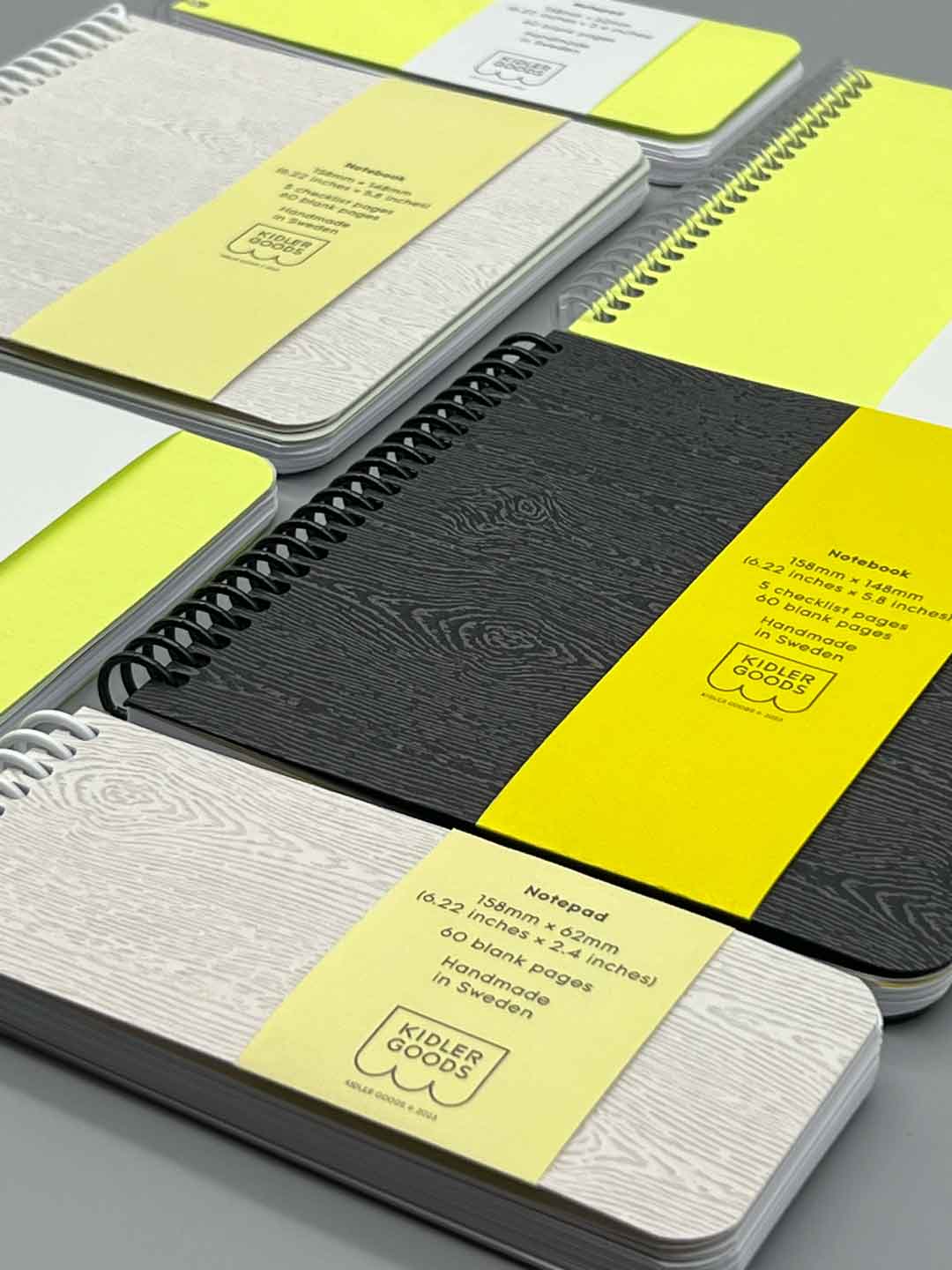 Notebooks and notepads of different sizes and colours