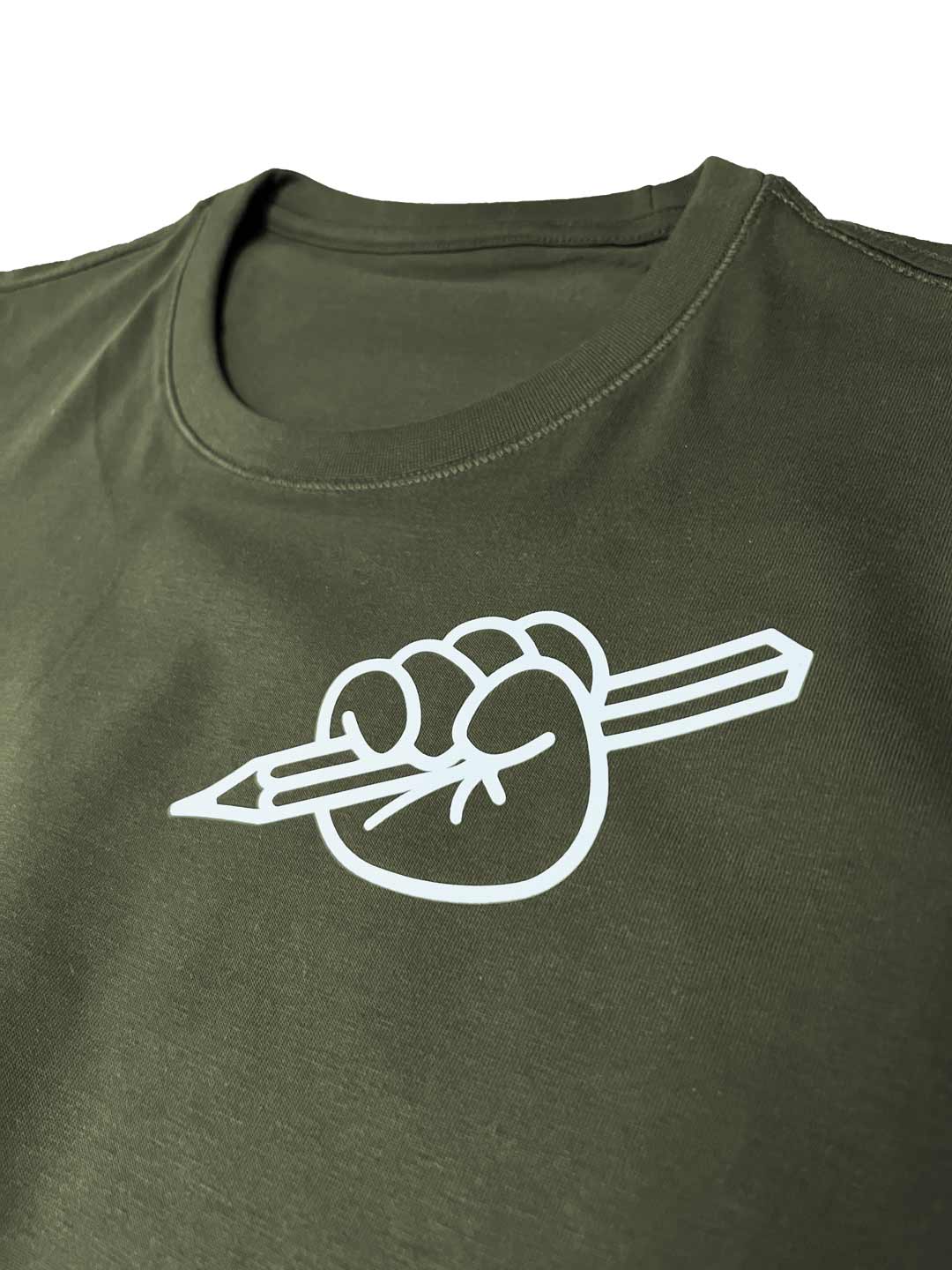 Close-up of olive green T-shirt from Kidler Goods 'Art at Heart' fist holding up a pencil