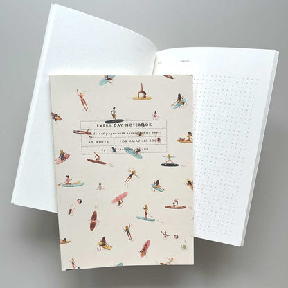 Paddle notebook from All the ways to say yes. Open spread with dotted grid.