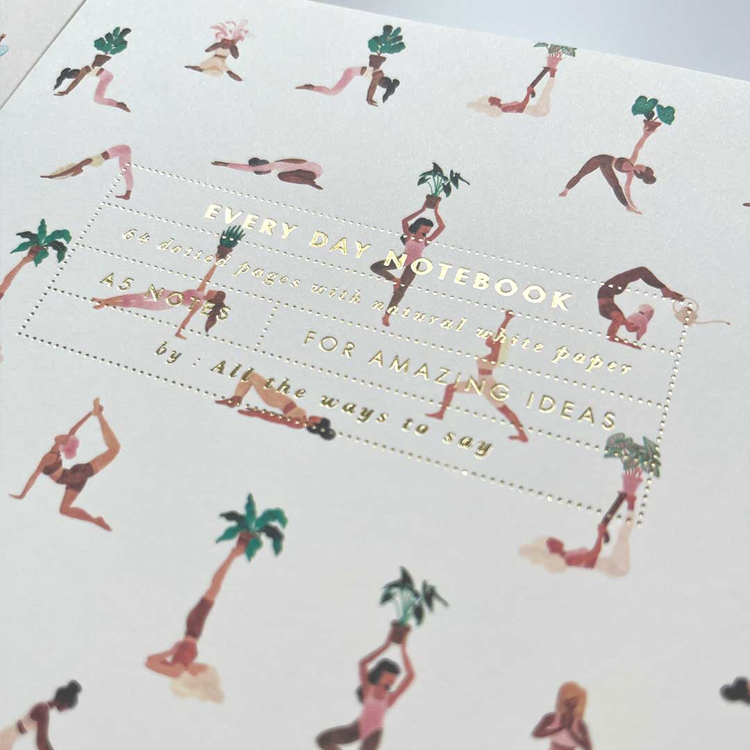 All the ways to say yes yoga close-up of notebook with gold foil print